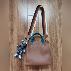 Brown with green handle should bag